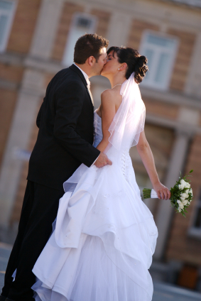 bride and bridegroom kissing on their wedding day